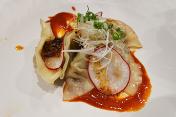 Close up Gyoza isolated, Japanese pan fried dumplings filled with ground meat, vegetables and wrapped in a thin dough