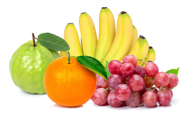 Pile of different types of fresh organic fruits ( yellow ripe banana, red grape,  orange fruit and guava with green leaf ) isolated on white background. 