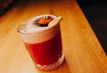 Sweet Famous white with caramels decoration slice  Author inspired Cocktail Drink - on bar counter . Close-up Top view . Copy paste space for design people and luxury service barman in nightclub