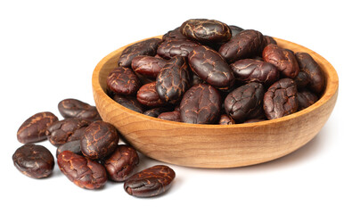 peeled cocoa beans in the wooden bowl, isolated on white background