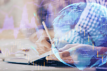 Multi exposure of two men planing investment with stock market forex chart.