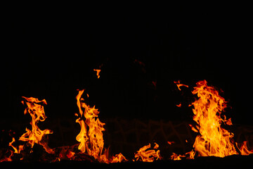 Fire flames isolated on black background. Copy space. 