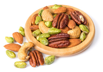 unsalted mixed nuts in the wooden plate, isolated on white background
