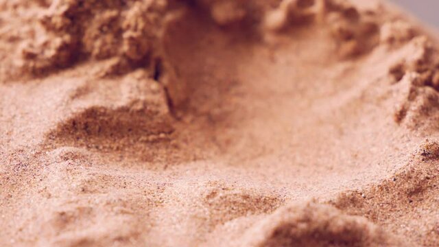 Sand landscape. Tilt-shift macro view with a smooth flight around. Silicon production. Quartz sand. Oxide mineral