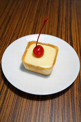 Close up lemon tart on wooden table