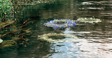 Wreaths of flowers floating on the water