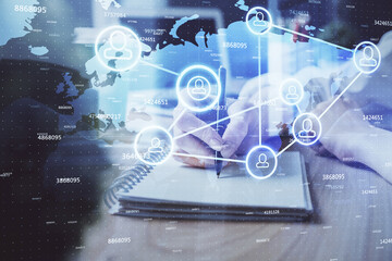 Social network theme hologram over woman's hands writing background. Concept of international people connect. Double exposure