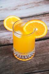 natural cold orange drink in a glass glass