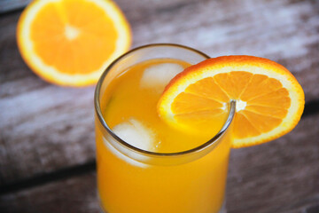 natural cold orange drink in a glass glass