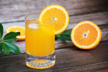 natural cold orange drink in a glass glass