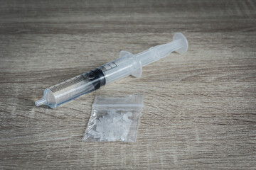 Drugs in plastic zipper bag on table,selective focus.