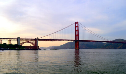 Fototapeta na wymiar San Francisco 2013, The smooth curve of the Golden gate Bridge in the bay with nice dusk colors