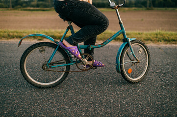 Picture of a chubby girl rides a bike in village
