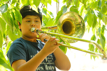 Playing the trombone.