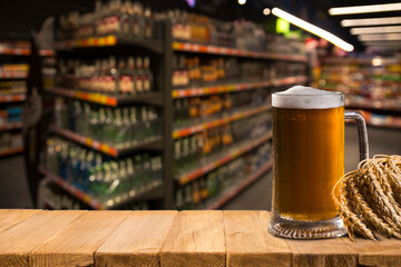 Beer style- bottle, beer in the glass and covers on wooden table. Free space for text. Top view