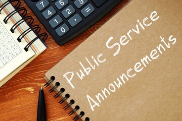 Business concept meaning Public Service Announcements with phrase on the piece of paper.