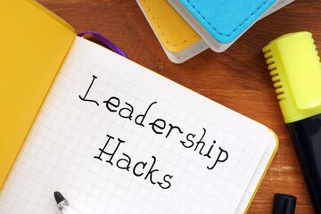 Career concept about Leadership Hacks with sign on the page.