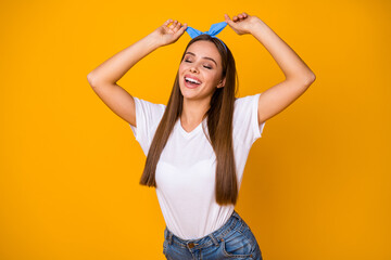 Fototapeta premium Portrait of attractive girl enjoy preparing for spring free time weekend walk adjust blue headband close eyes wear good look clothes isolated over bright color background