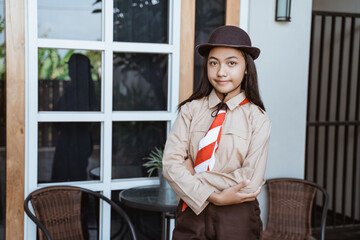 beautiful indonesian junior high school student portrait wearing girl scout uniform