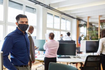 Businessman with face mask because of Covid-19