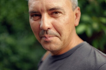 Fototapeta premium Caucasian mature man close up portrait. Real people authentic lifestyle portrait.