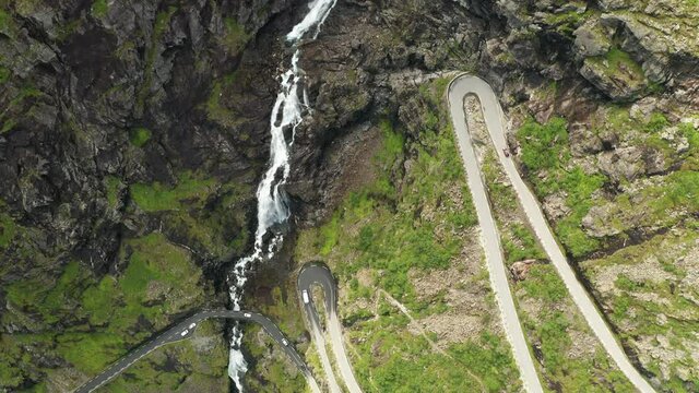 Trollstigen or Trolls Path is a serpentine mountain road at sunset. Rauma Municipality in Norway
