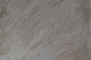 Traces of spatula on cement and sand plaster