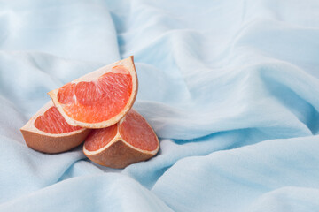 Blue installation - still life for blogger as blue background, modern art. Abstract with grapefruit and blue cloth