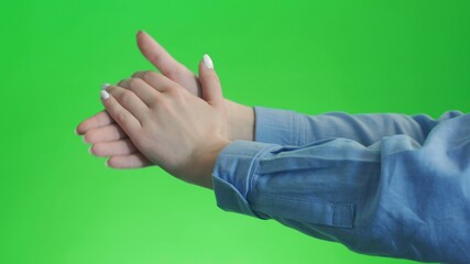 Girl doing claps her hands on a green screen background