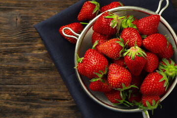 Red ripe fresh strawberry with leaves close up