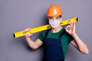 Close-up portrait of his he attractive healthy guy workman wearing safety gauze mask glasses stop...