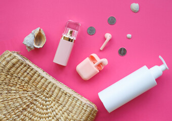 set of summer women's accessories on a pink background