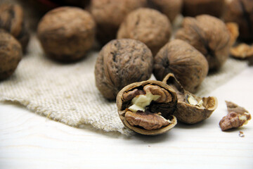 Fresh walnuts on a wooden background
