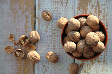 Fresh walnuts on a wooden background