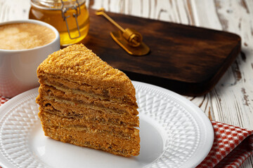 Slice of layered honey cake on plate
