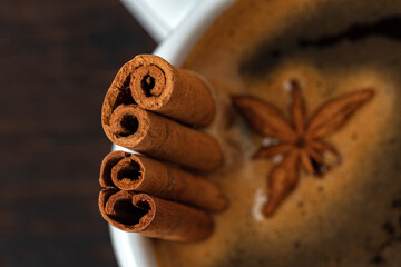 Cup of americano coffee with cinnamon close up