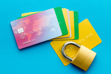 credit card with security lock on blue desk top view