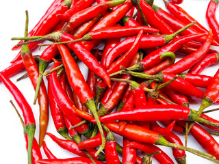 Top view pile of fresh red hot chili isolated on white background.
