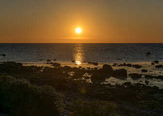 Fototapeta premium sunset landscape from a traditional rocky beach on the island of Saaremaa, Cape Undva, Tagamoisa Peninsula, Saaremaa Island, Estonia
