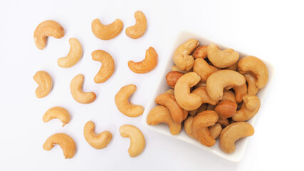 Top view of cashews nut in white bowl
