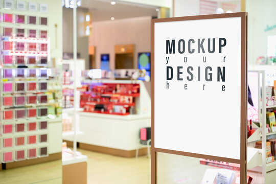 Mock Up Of Vertical Poster Billboard With Blurred Cosmetic Shop Background.