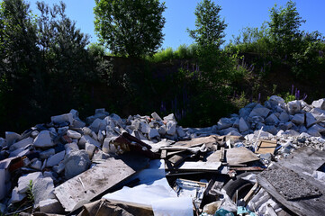 Photo with trash outdoors on a sunny summer day against a cloudless sky