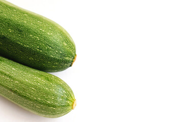 Green zucchini on a white background. The harvest of zucchini.Green vegetables.