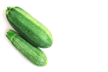Green zucchini on a white background. The harvest of zucchini.Green vegetables.