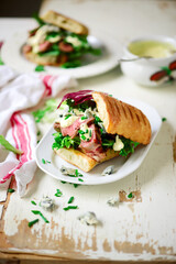 Grilled steak sandwiches with mustard sauce.