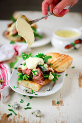Grilled steak sandwiches with mustard sauce.