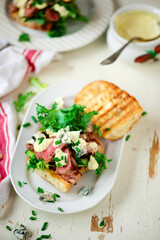 Grilled steak sandwiches with mustard sauce.