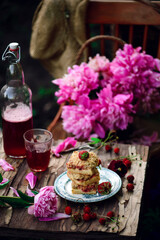 Obraz na płótnie Canvas Strawberry rhubarb cheesecake bars..style vintage.outdoor photo