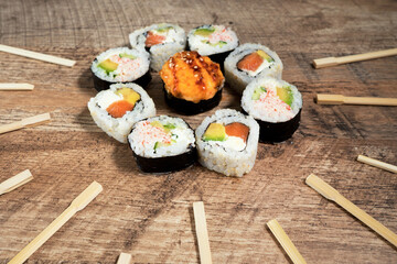 Sushi roll set with chopsticks. Japan sun concept. Place for your text or logo.