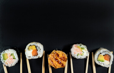 Sushi roll set with chopsticks. Place for your text or logo.